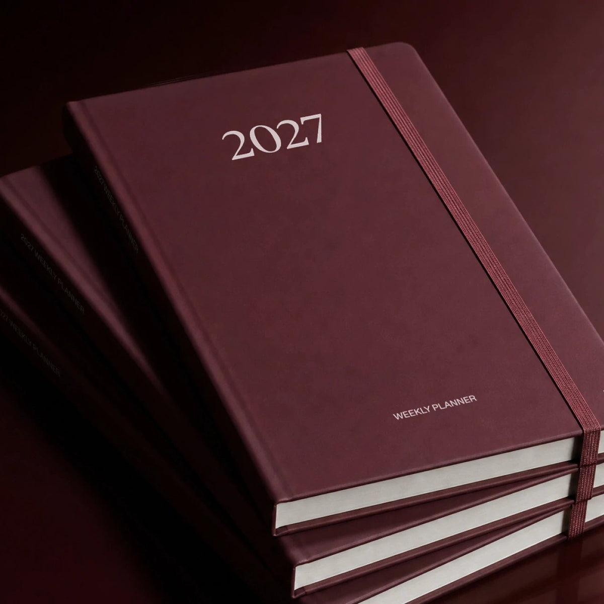 Wochenplaner 2027 – Steinpapier · A5 Hardcover · Burgundy | Karst